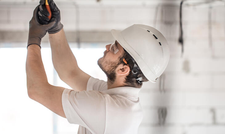 Electrician conducting general electrical maintenance in Ocean Grove home